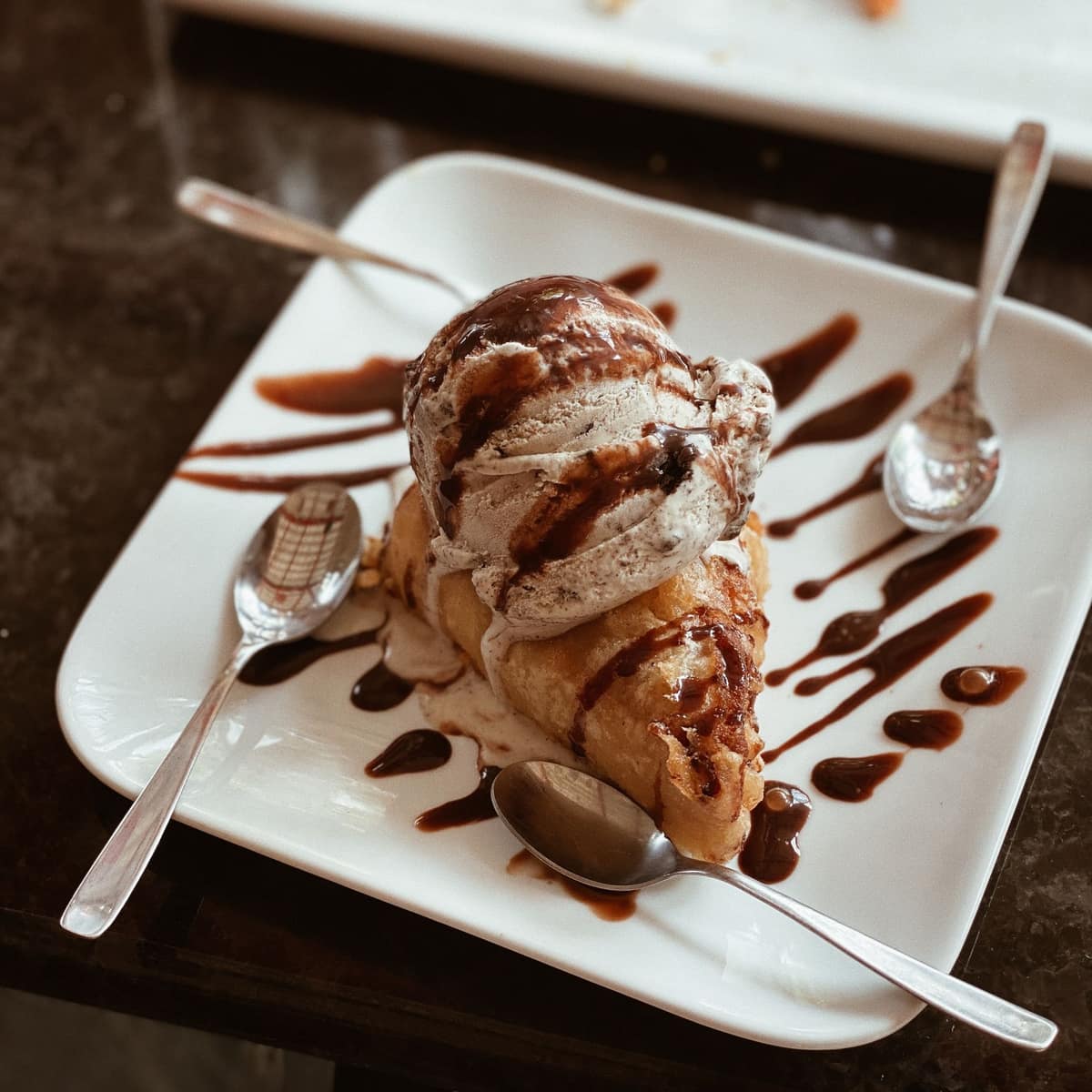 Croissant with ice cream and chocolate sauce
