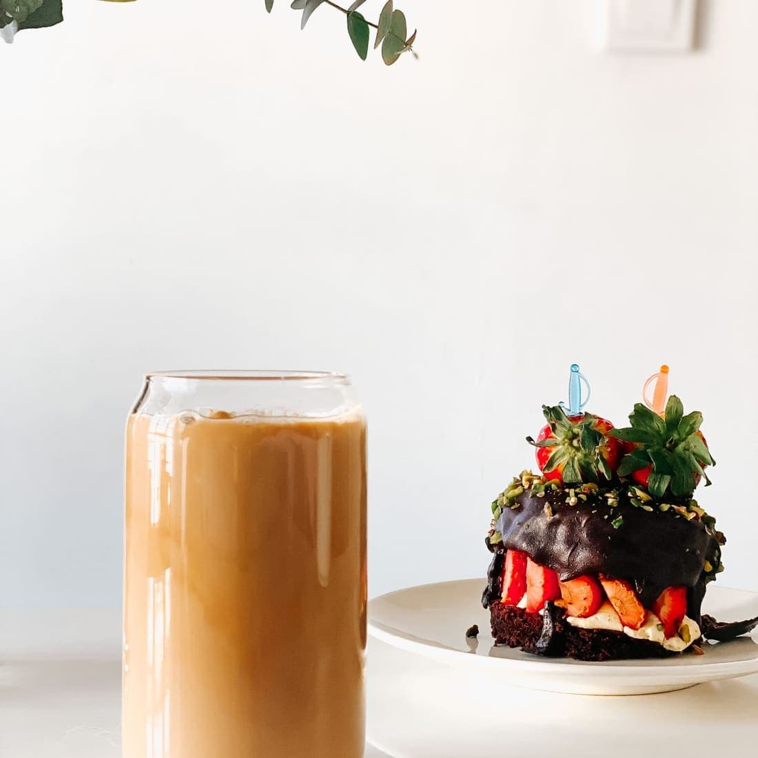 Iced coffee served with a chocolate dessert